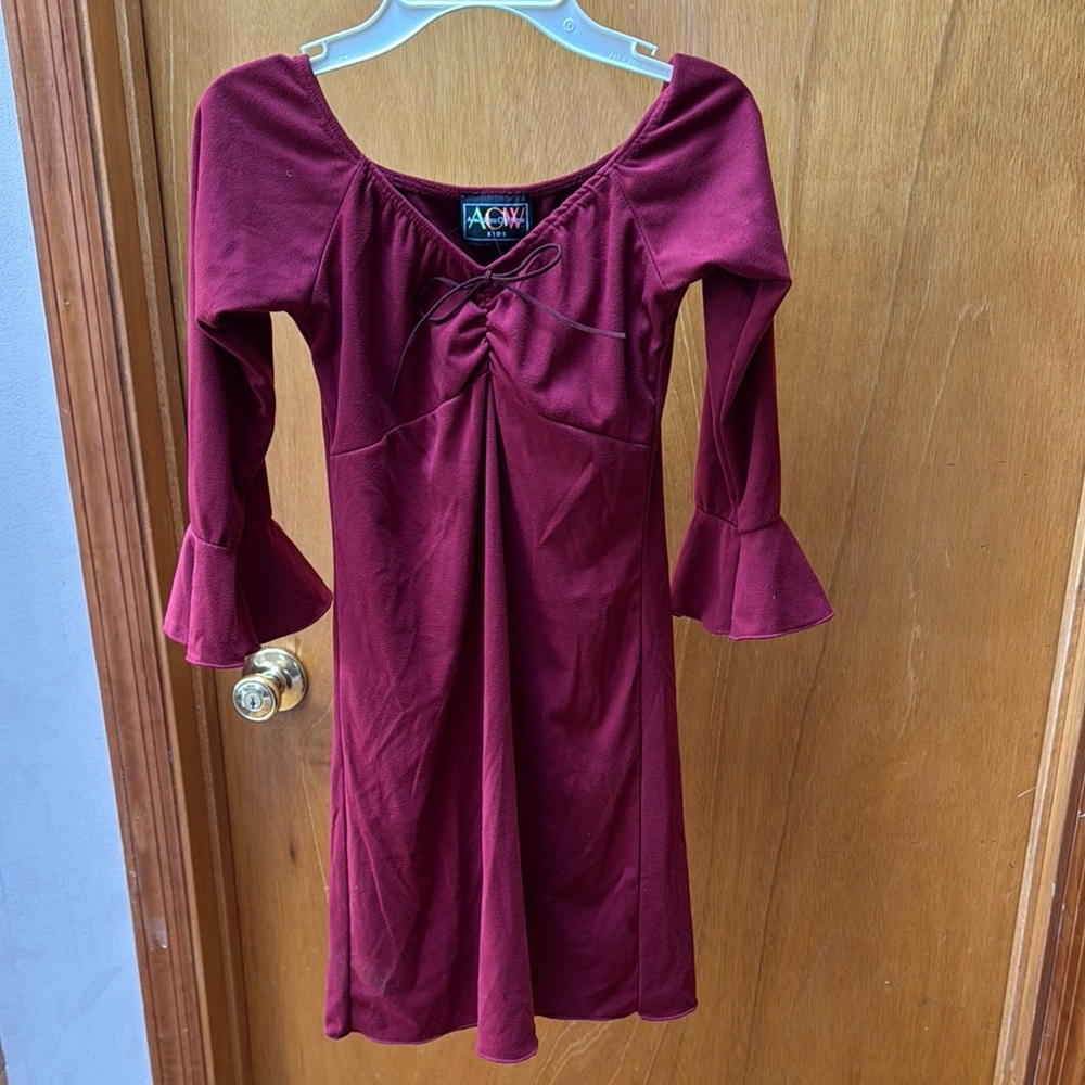 NWT girls dress from American City Wear. Size 10-12